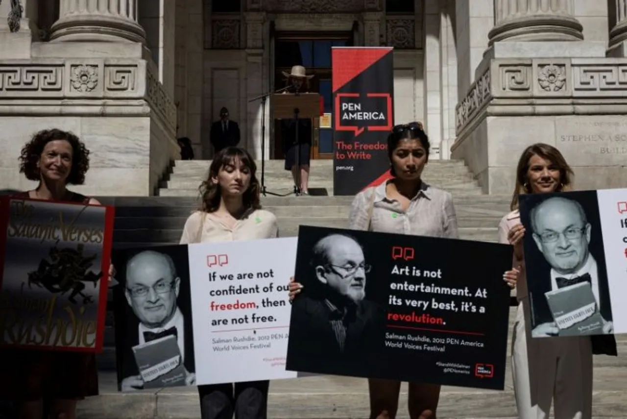 A group of writers and supporters gather in solidarity in support of author Salman Rushdie outside the New York Public Library