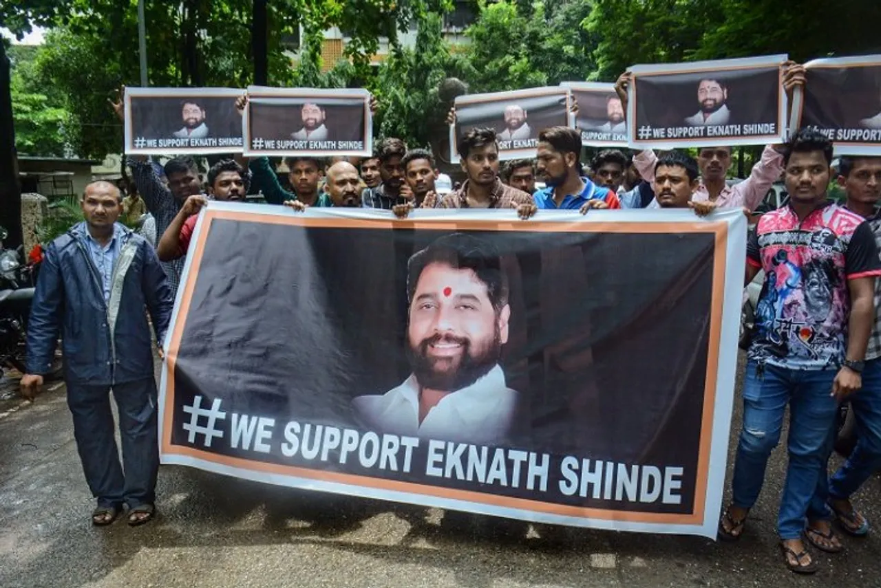 Supporters of rebel Shiv Sena leader Eknath Shinde outside his residence, in Thane