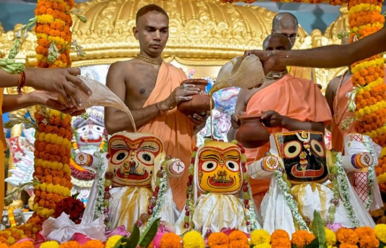 Priests perform holy bath of Lord Jagannath and other deities on the occasion of Snan Yatra festival