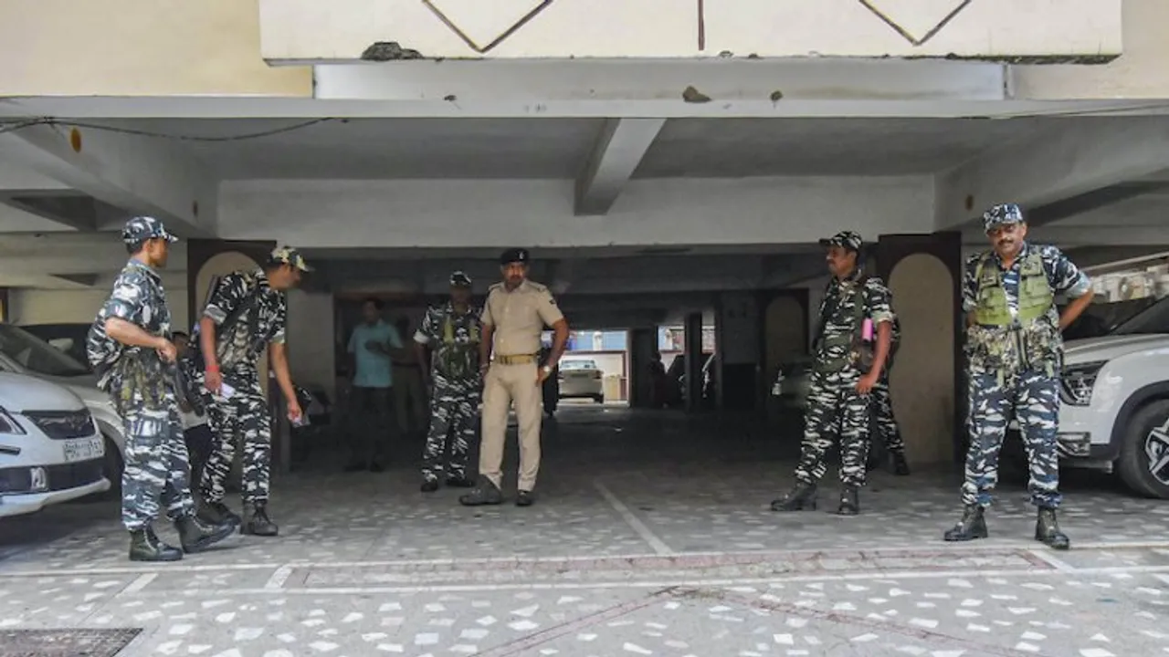 Security personnel outside the residence RJD MLC Sunil Kumar during a raid by Central Bureau of Investigation (CBI) in connection with the alleged land-for-jobs scam that took place when Lalu Prasad was the railway minister, in Patna, Wednesday