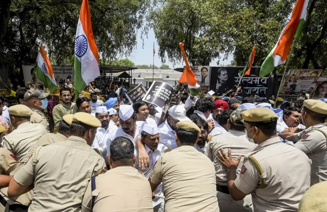 Police stop Congress workers who were staging a protest outside the AICC office