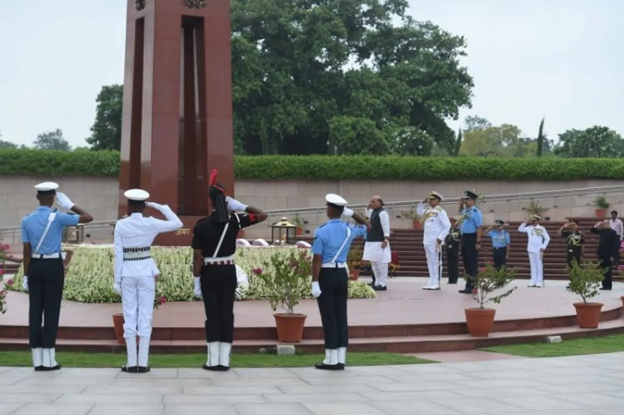 Union Defence Minister Rajnath Singh with Army Chief General Manoj Pande (unseen), IAF Chief Air Chief Marshal VR Chaudhari and Navy Chief Admiral R Hari Kumar pays homage at the National War Memorial on the occasion of Kargil Vijay Diwas, in New Delhi