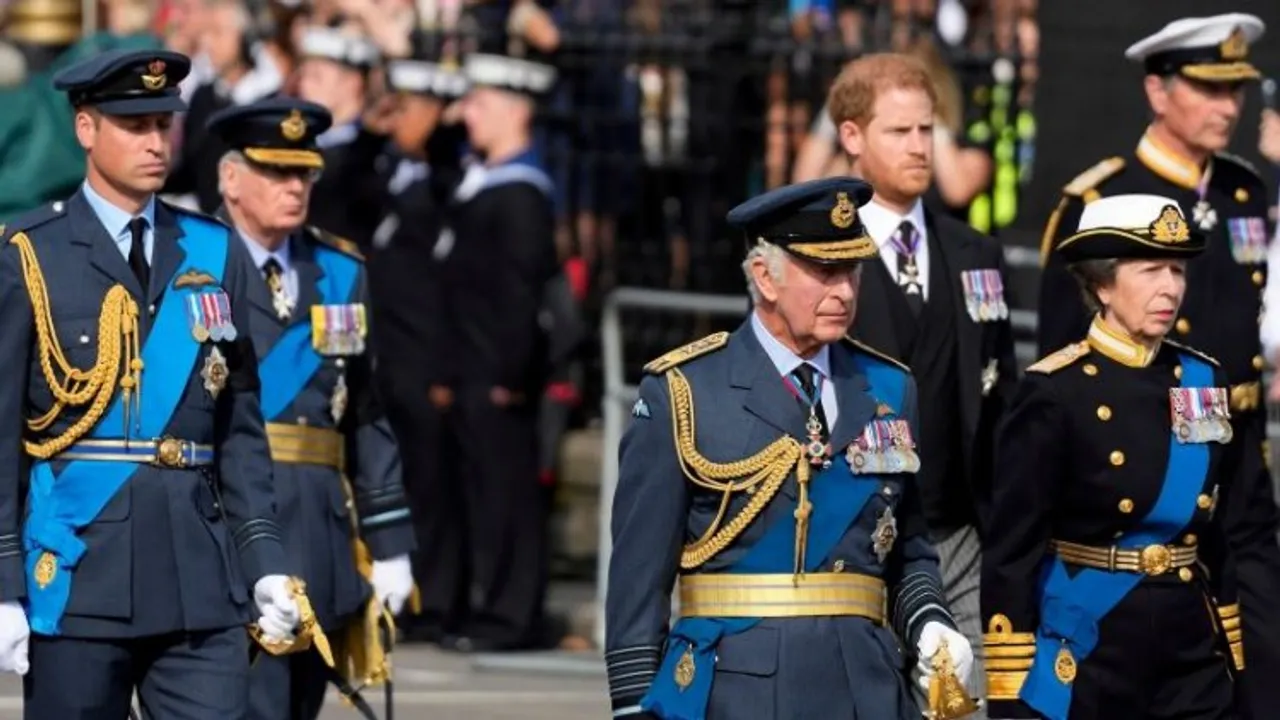 The children of the Queen, King Charles III, Prince Edward and Princess Anne, and her grandson Prince William dressed in military uniforms with medals