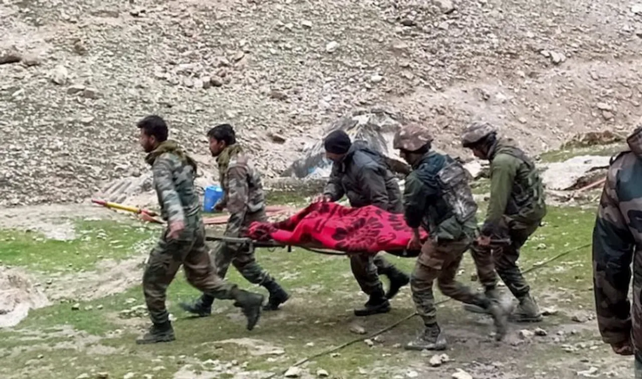 Indian Army rescuing  Amarnath pilgrims who were injured in the flash flood triggered by heavy rain