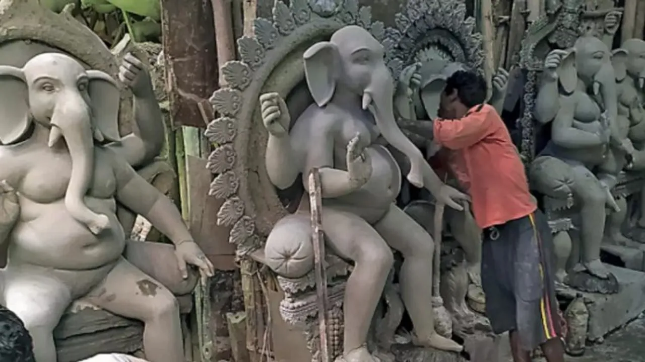 Clay modelers of Kumartuli making Ganesh idols