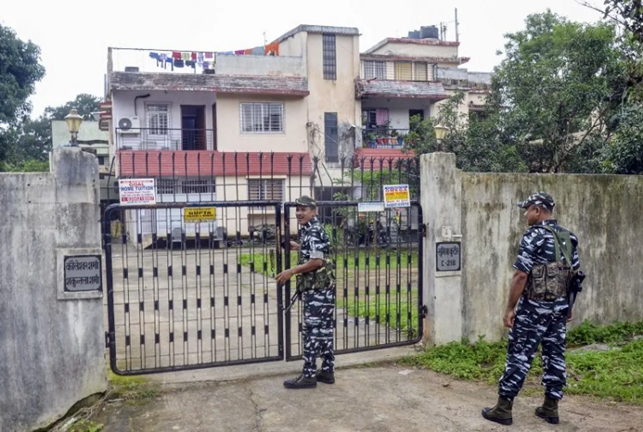 Central Reserve Police Force (CRPF) personnel stand guard during a raid by ED in a property allegedly belonging to a close aide of Jharkhand CM Hemant Soren as part of an ongoing money-laundering investigation into alleged illegal mining in the state, in Ranchi