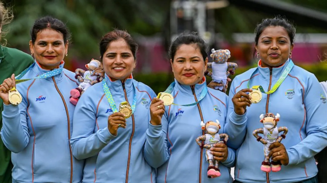 Indias Lovely Choubey, Pinki, Nayanmoni Saikia and Rupa Rani Tirkey pose for photos during a presentation ceremony after winning the Lawn Bowls Womens Fours final match against South Africa, at the Commonwealth Games 2022 (CWG), in Birmingham, UK, Tuesday