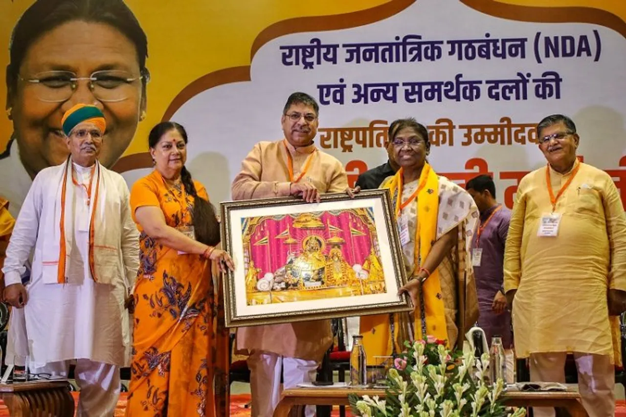 NDA presidential candidate Draupadi Murmu being welcomed by former Chief Minister Vasundhara Raje, State BJP President Satish Poonia and other party leaders at a meeting to seek support, in Jaipur