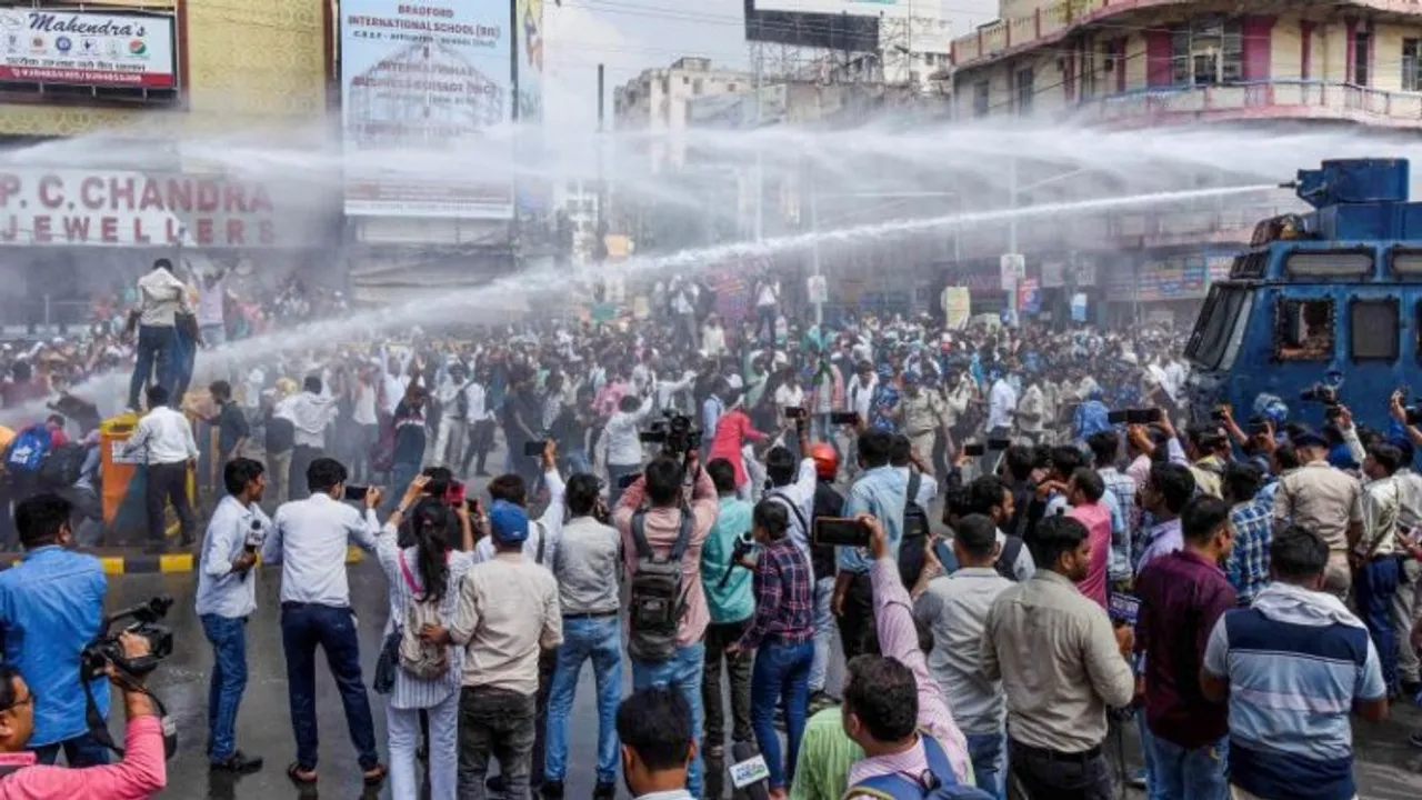 Security personnel use water canons to disperse Central Teacher Eligibility Test (CTET) and Bihar Teacher Eligibility Test (BTET) qualified candidates during their protest demanding permanent jobs, in Patna
