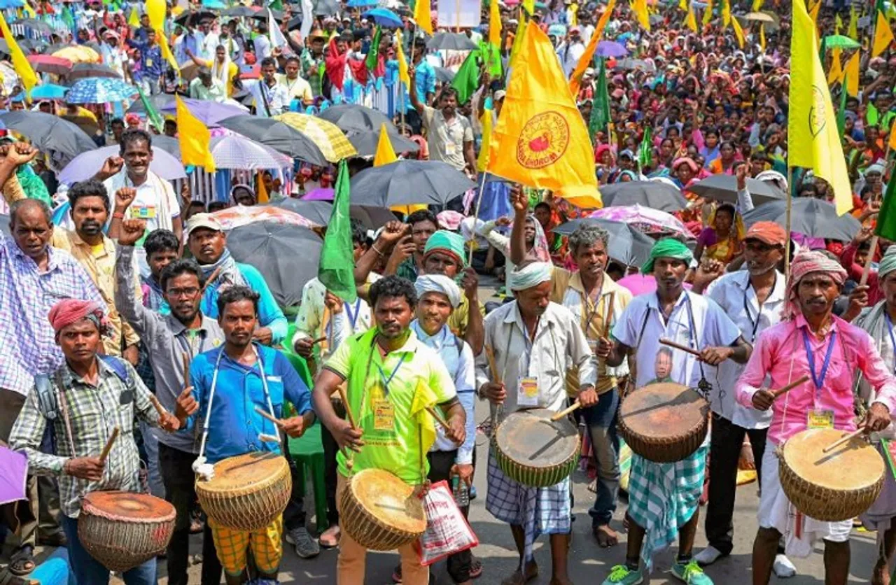 Members of Adivasi Sengel Abhiyan perform during their rally demanding recognition of the Sarna Dharam Code, in Kolkata