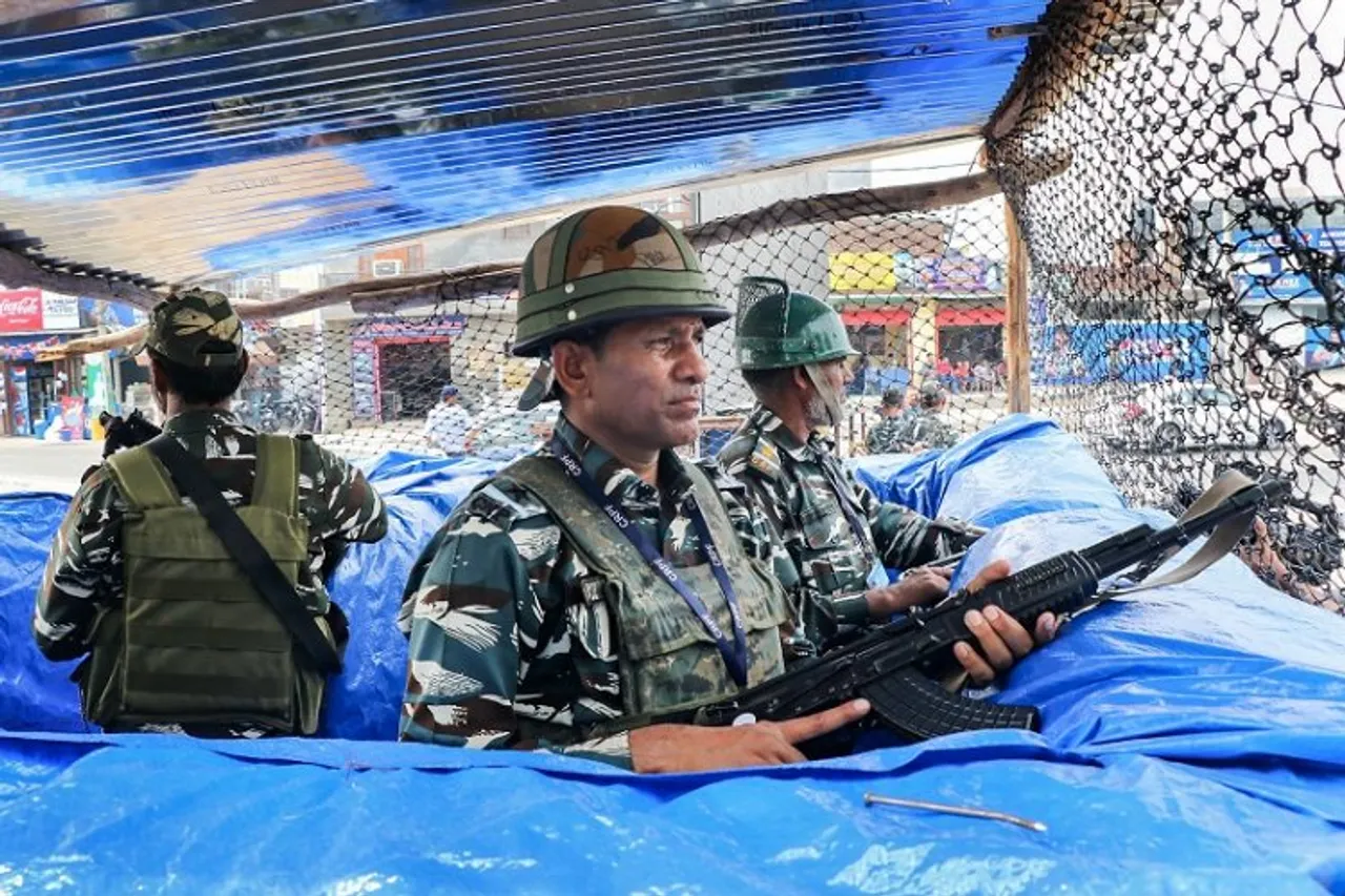 Security personnel stand guard at a base camp of Amarnath Yatra, in Jammu