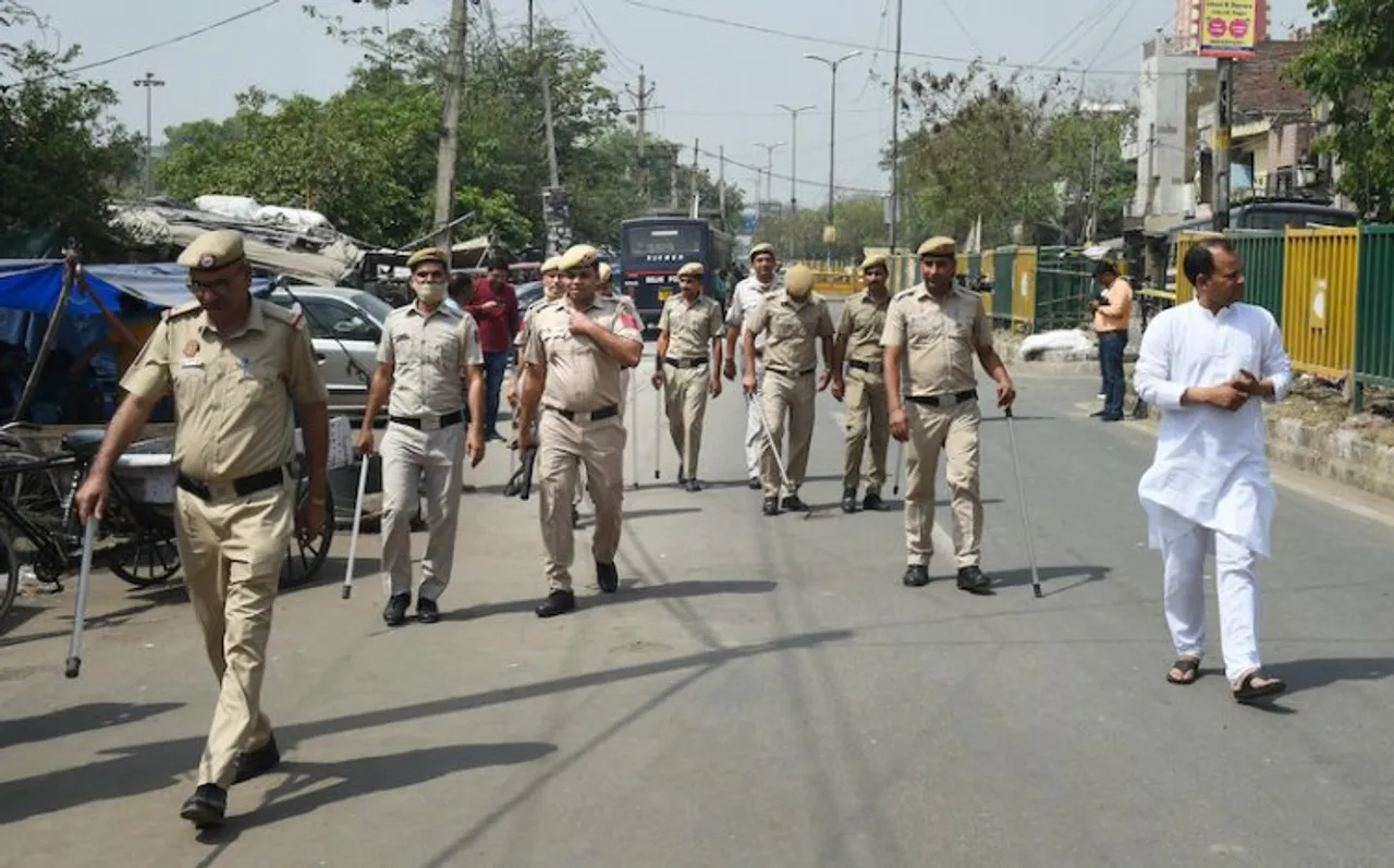 Delhi police personel keeping vigil in Jahangir Puri of Delhi after clashes between two groups