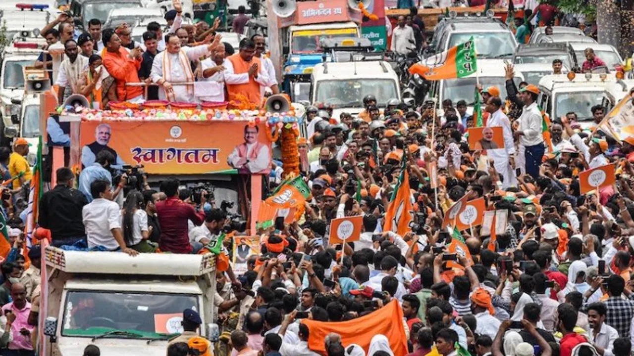 BJP National President JP Nadda waves at his supporters during a roadshow, in Patna on Saturday