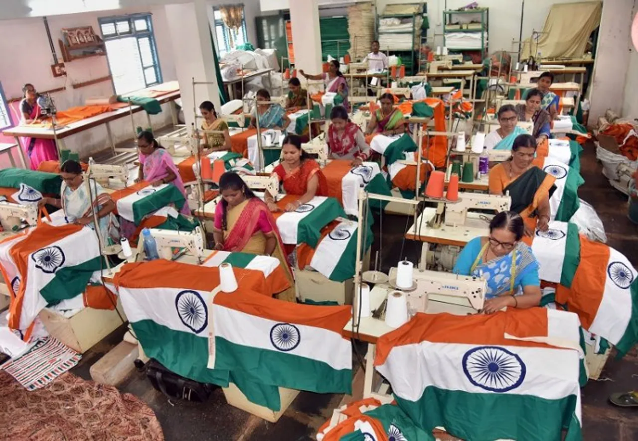 Workers prepare Indian national flags ahead of the 75th Independence Day celebrations, at the Karnataka Khadi Gramodyoga Samyukta Sangha (KKGSS), the only unit in India that is authorised to manufacture and supply the Indian flag, in Hubballi, Friday
