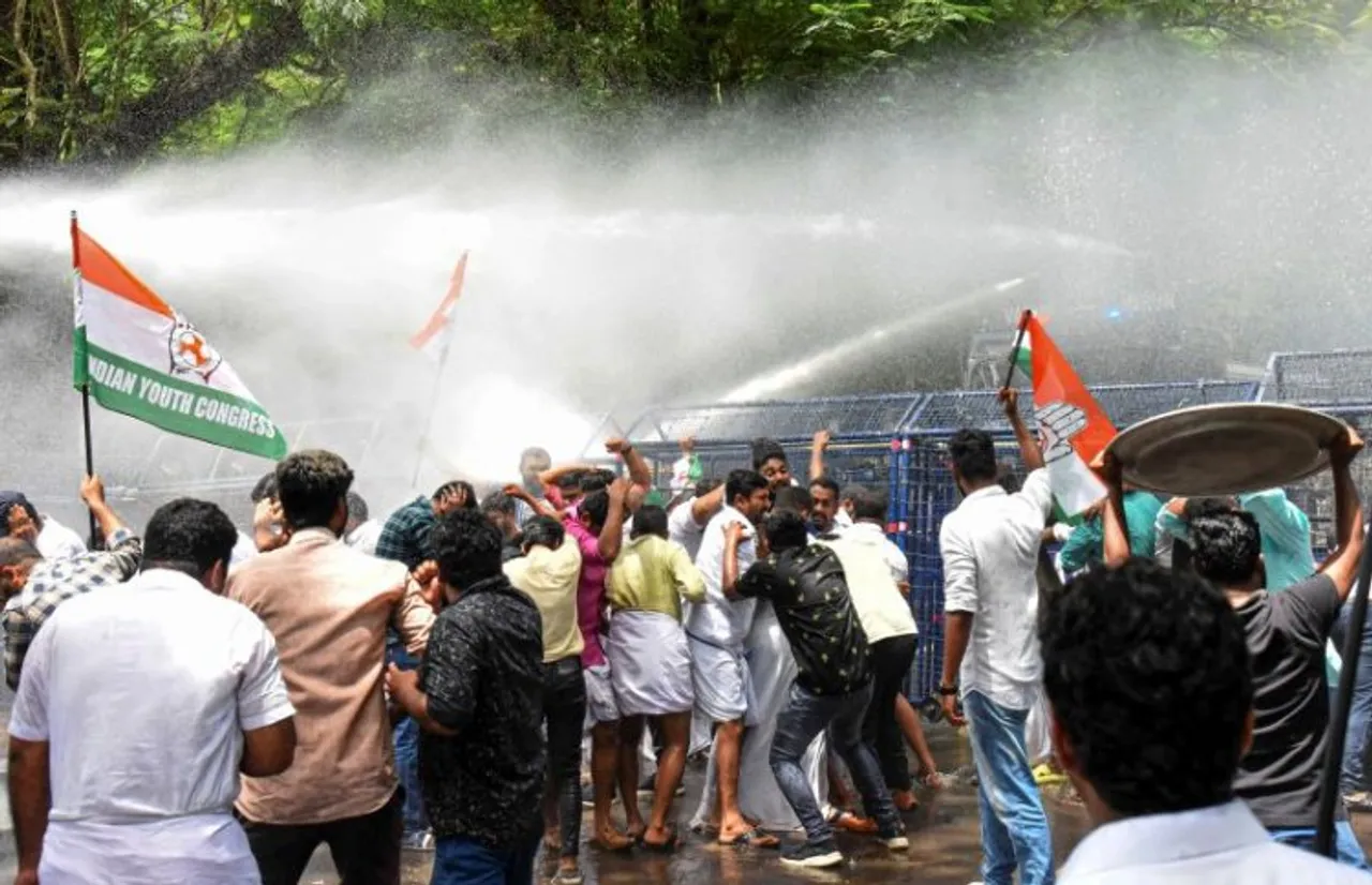 Police personnel use water cannons to disperse Youth Congress activists
