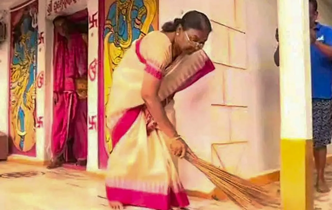 NDA presidential candidate Droupadi Murmu sweeping the floor of a Shiva temple in her locality, in Odisha