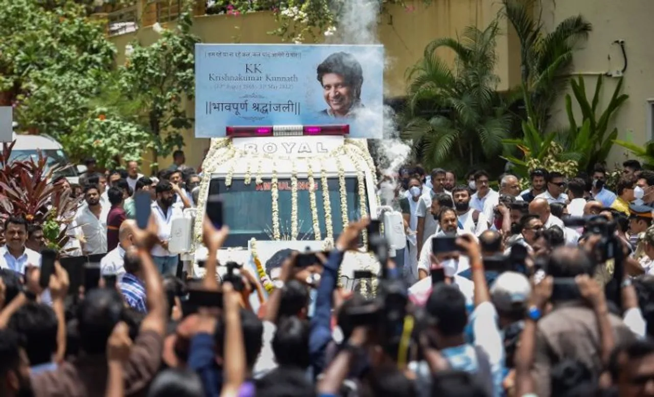 An ambulance adorned with flowers and a picture of KK, carried the singer's body to the crematorium