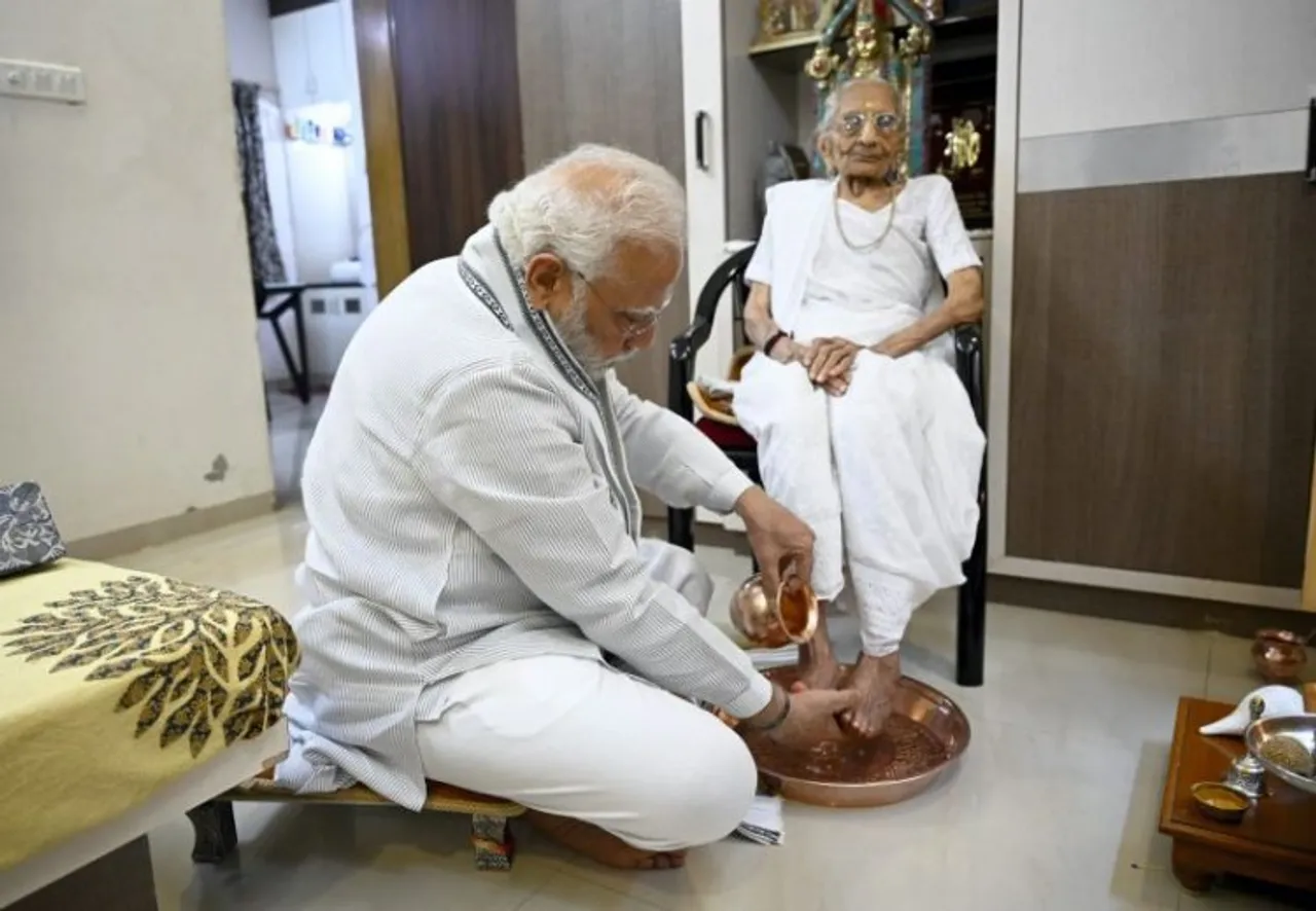 Prime Minister Narendra Modi takes blessings of his mother Heeraba on her 100th birthday, at her residence in Gandhinagar