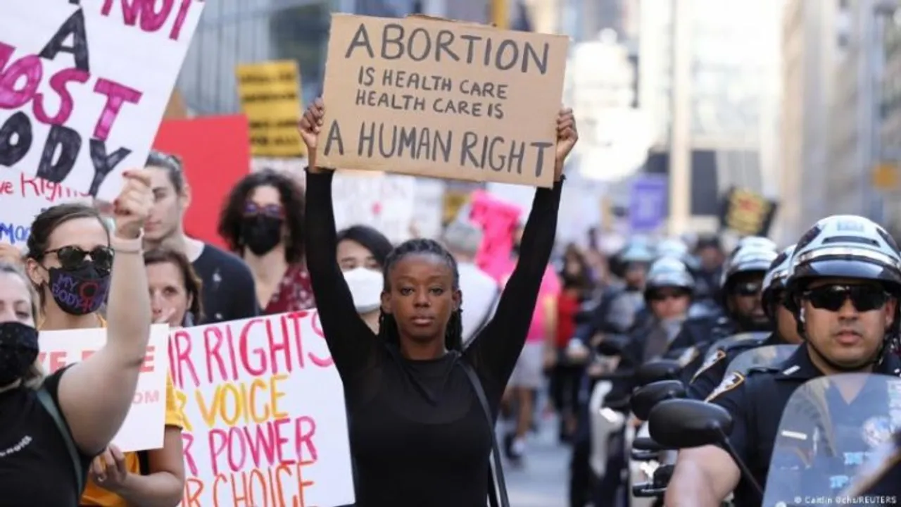 Woman of Color protesting for her right to Abortion in the US streets