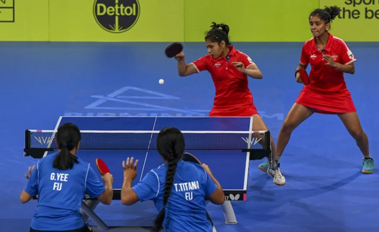 Indian (red) women table tennis players D.Chaitale and S.Akula in action against T.Titana and G.Yee of Fiji during Commonwealth Games 2022, at National Exhibition Centre (NEC) in Birmingham