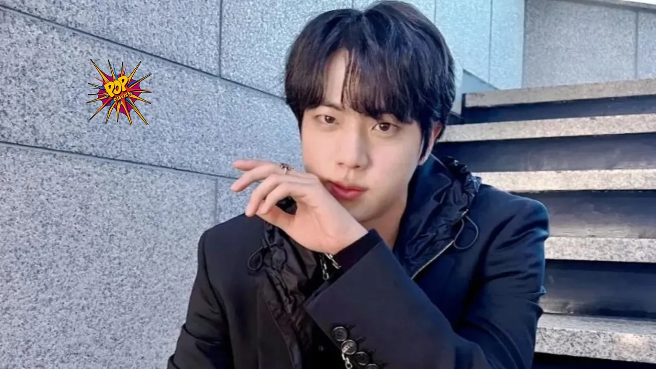 BTS’s Jin breaks gender norms in a new W Korea photoshoot, wearing a wrap-around skirt over pants, further proving that fashion knows no gender boundaries.