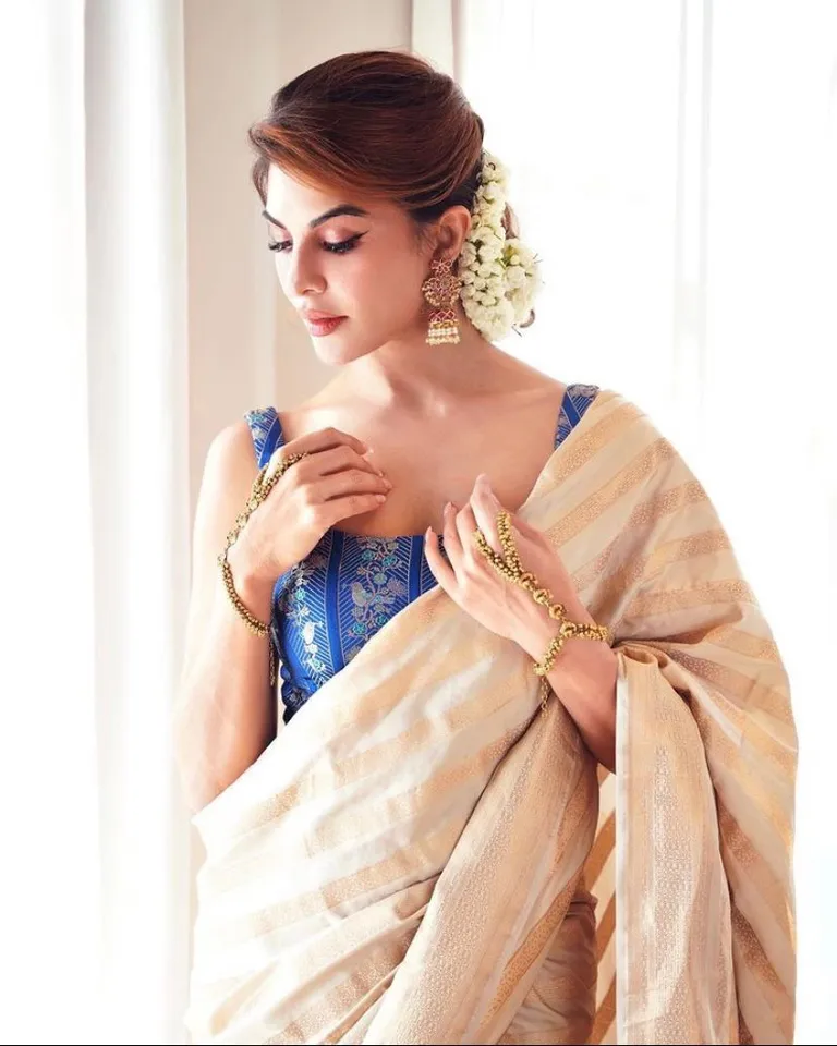 Jacqueline Fernandez looks absolutely gorgeous in a saree, and asks fans if they have heard her latest song RaRaRakkamma