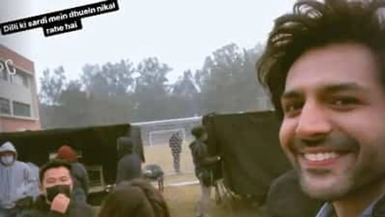 Kartik Aaryan shoots for Shehzada in Delhi's cold weather, says 'dhuein nikal gaye'. Watch