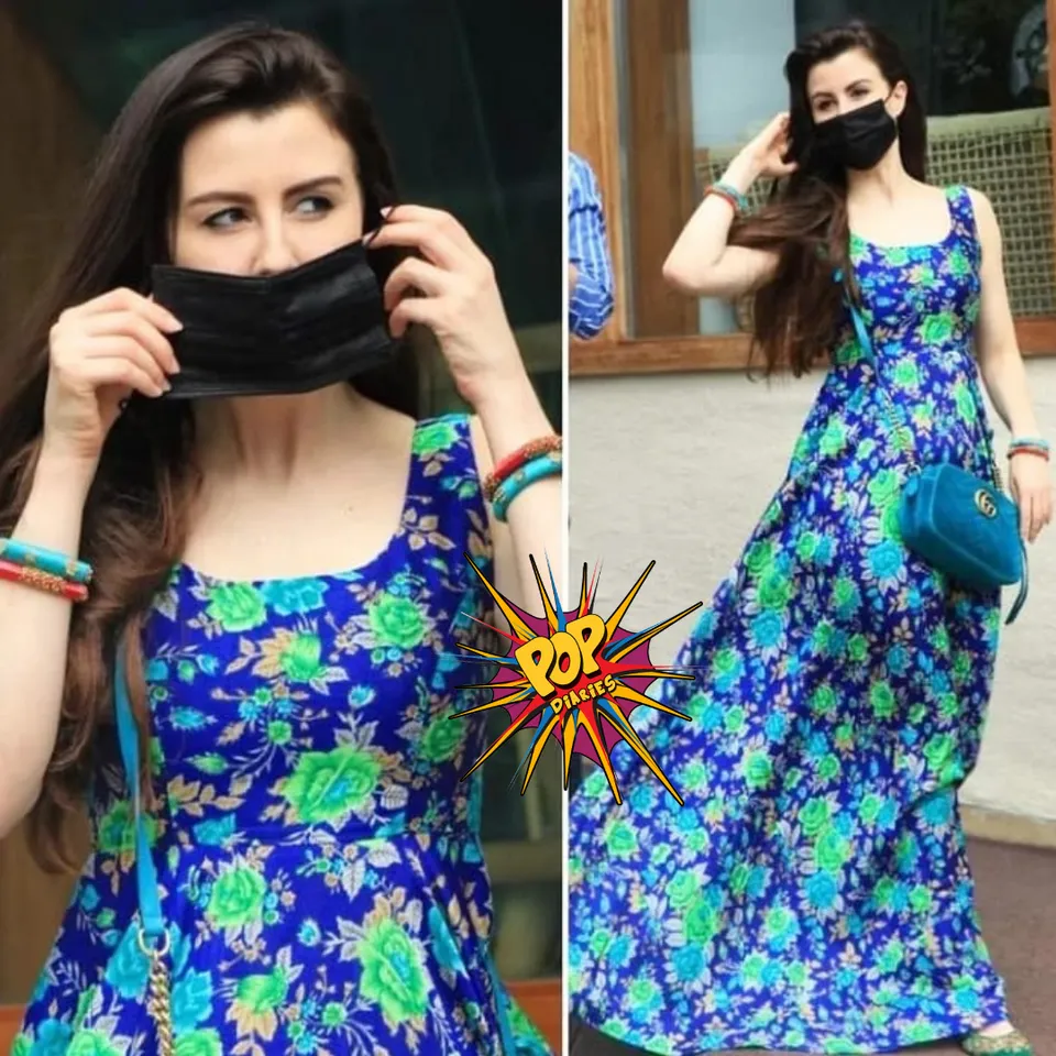 <em>Giorgia Andriani giving us 'Desi Girl' vibe in this this blue floral maxi dress along with Rs 10,000 Gucci sling bag as she was spotted around in the city</em>