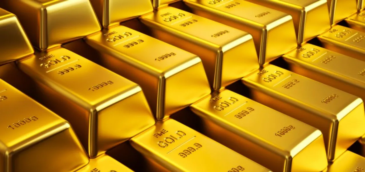 Gold slips on global cues, tepid demand