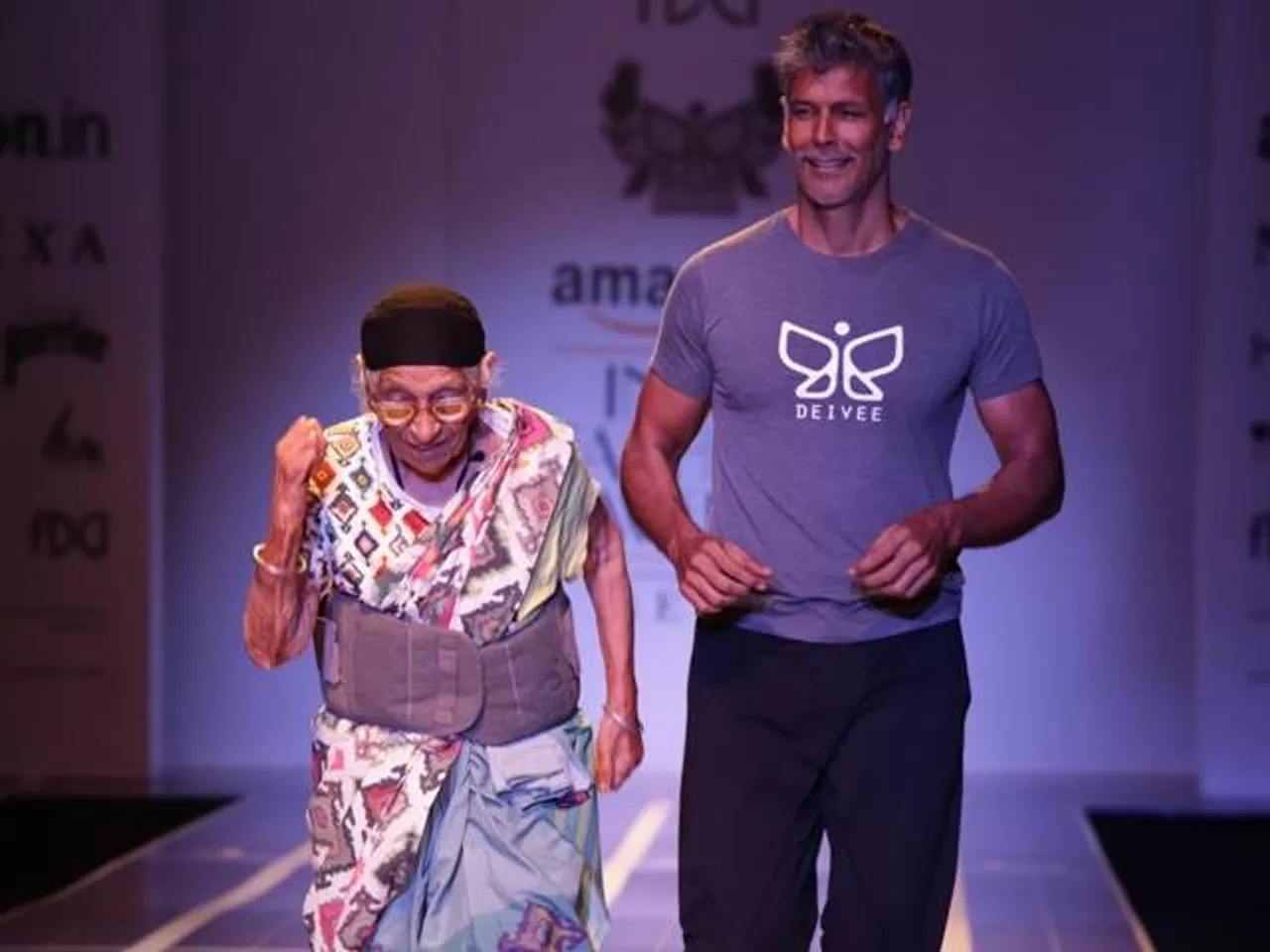 101 YEARS OLD RUNNER,  MANN KAUR WALKS RAMP WITH MILIND SOMAN