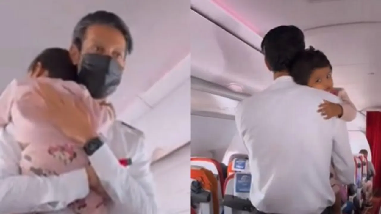 Flight attendant clams down baby on airplane [Watch Video]