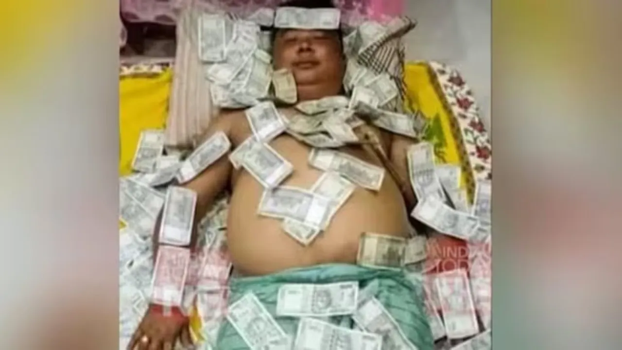 assam politician sleeping on indian currency