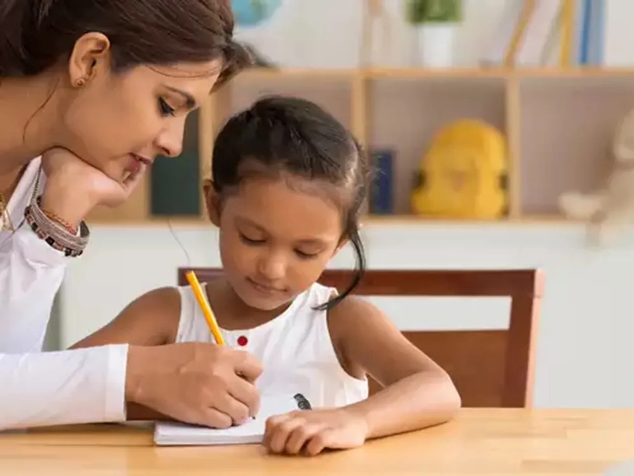 mom daughter writing