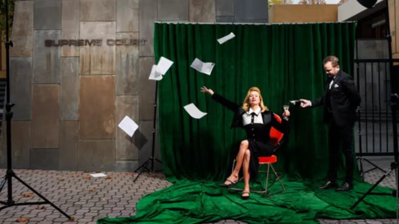 Artist Kirsha Kaechele performing outside the supreme court with props from her Ladies Lounge installation, following a court order to admit men to the lounge. Photograph: Jesse Hunniford