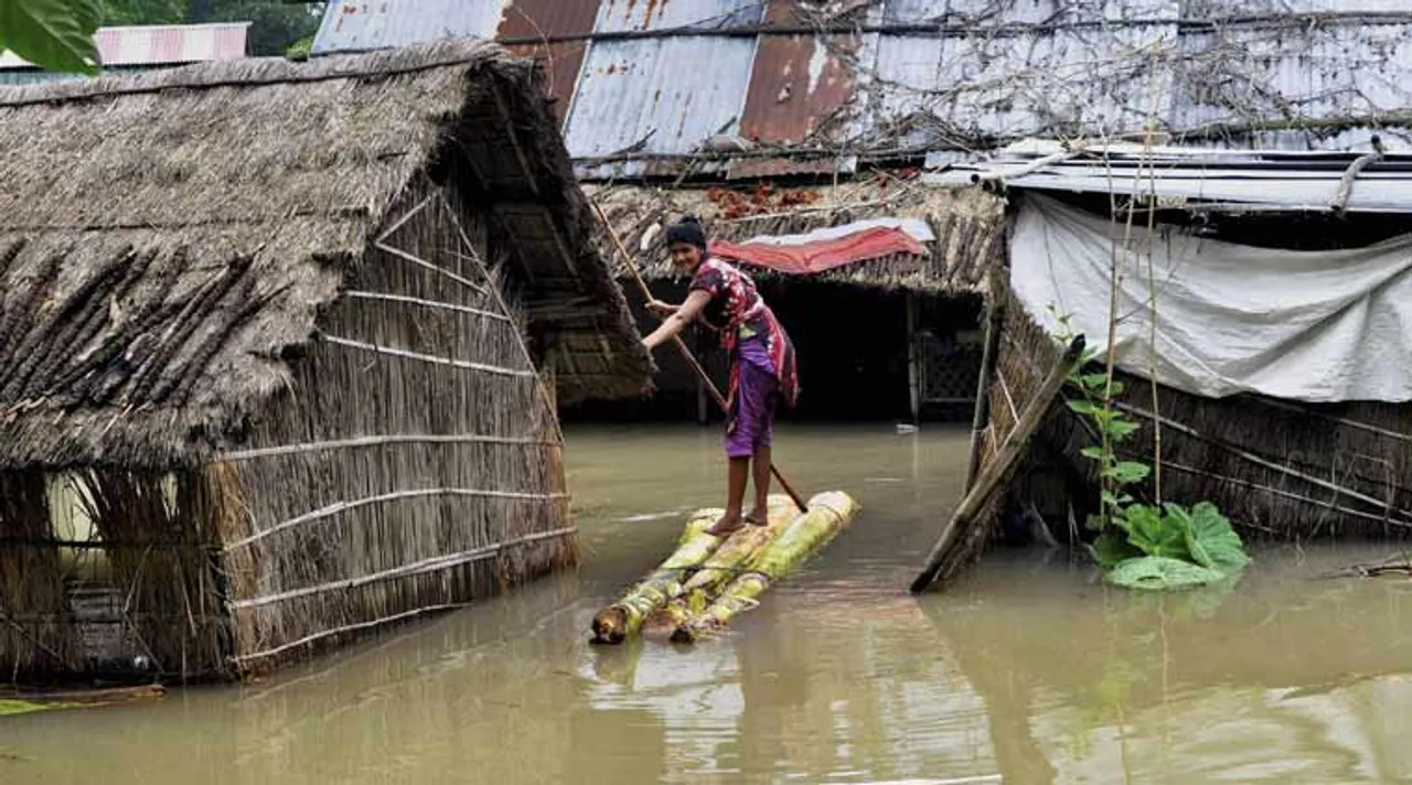 Woman in floods, Assam flood