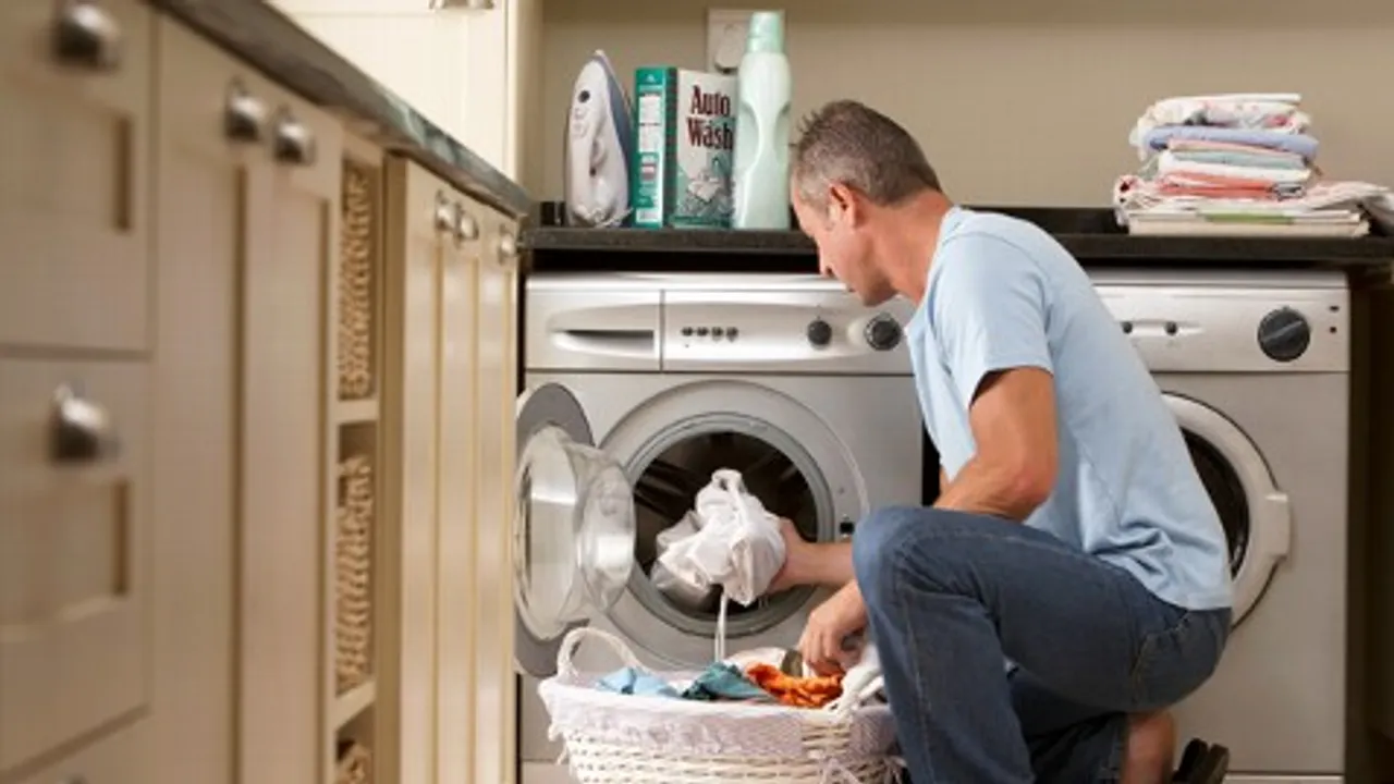 Is the 'modern man' helping his wife with chores?