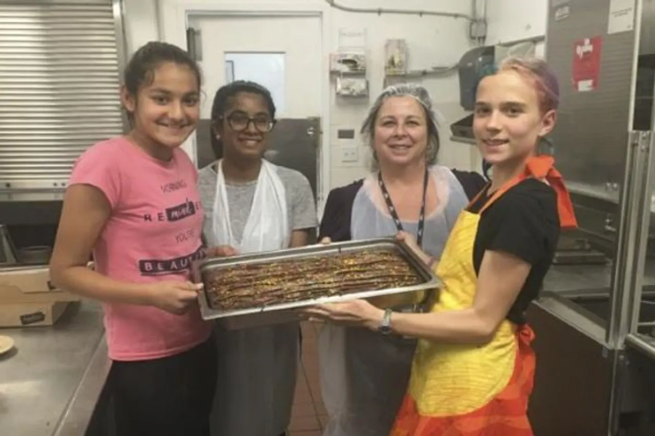 Teenager distributes sweets among the needy ,Teenagers distribute sweets among the needy