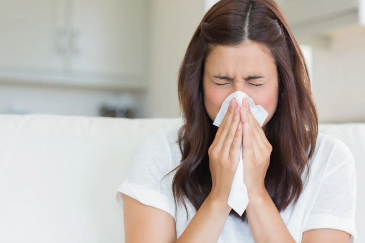 Girl Sneezing