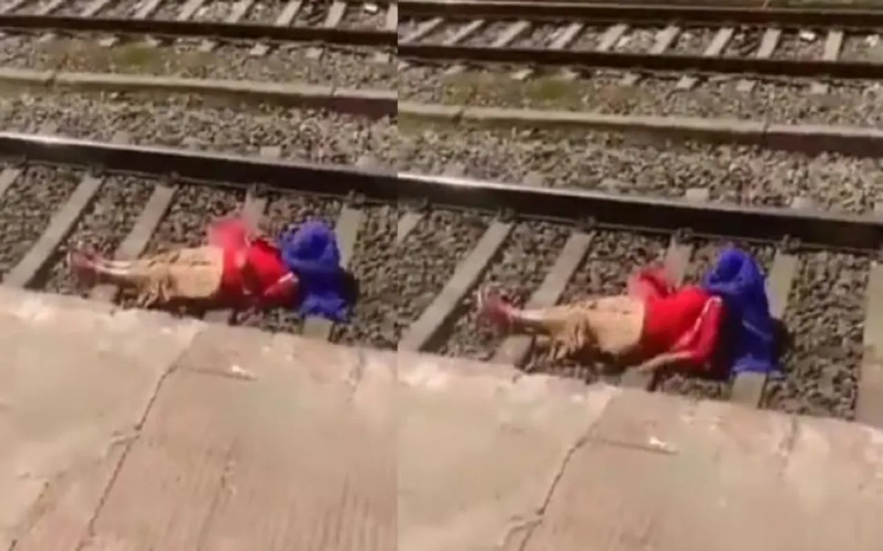 woman lying on railway track