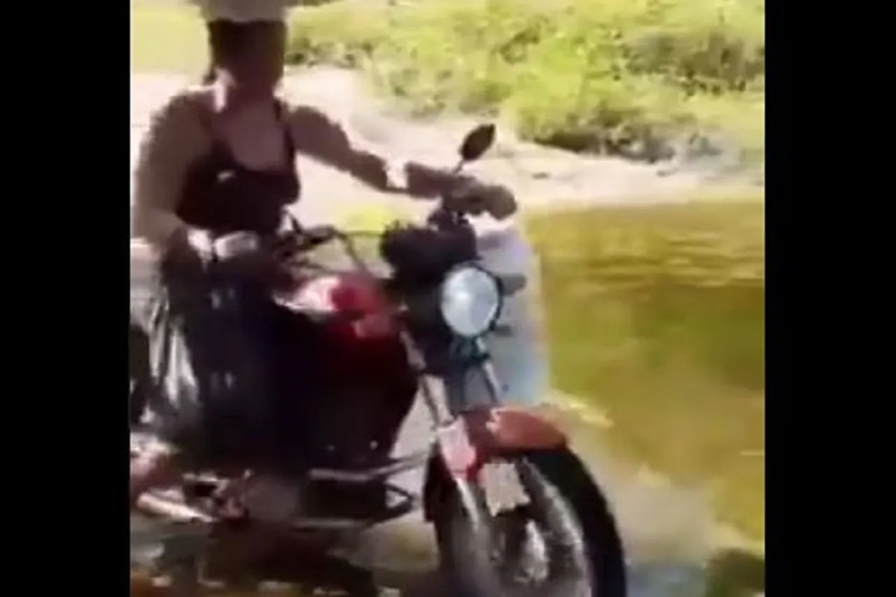 Woman Rides Bike On Water With Utensils On Her Head, Video Goes Viral