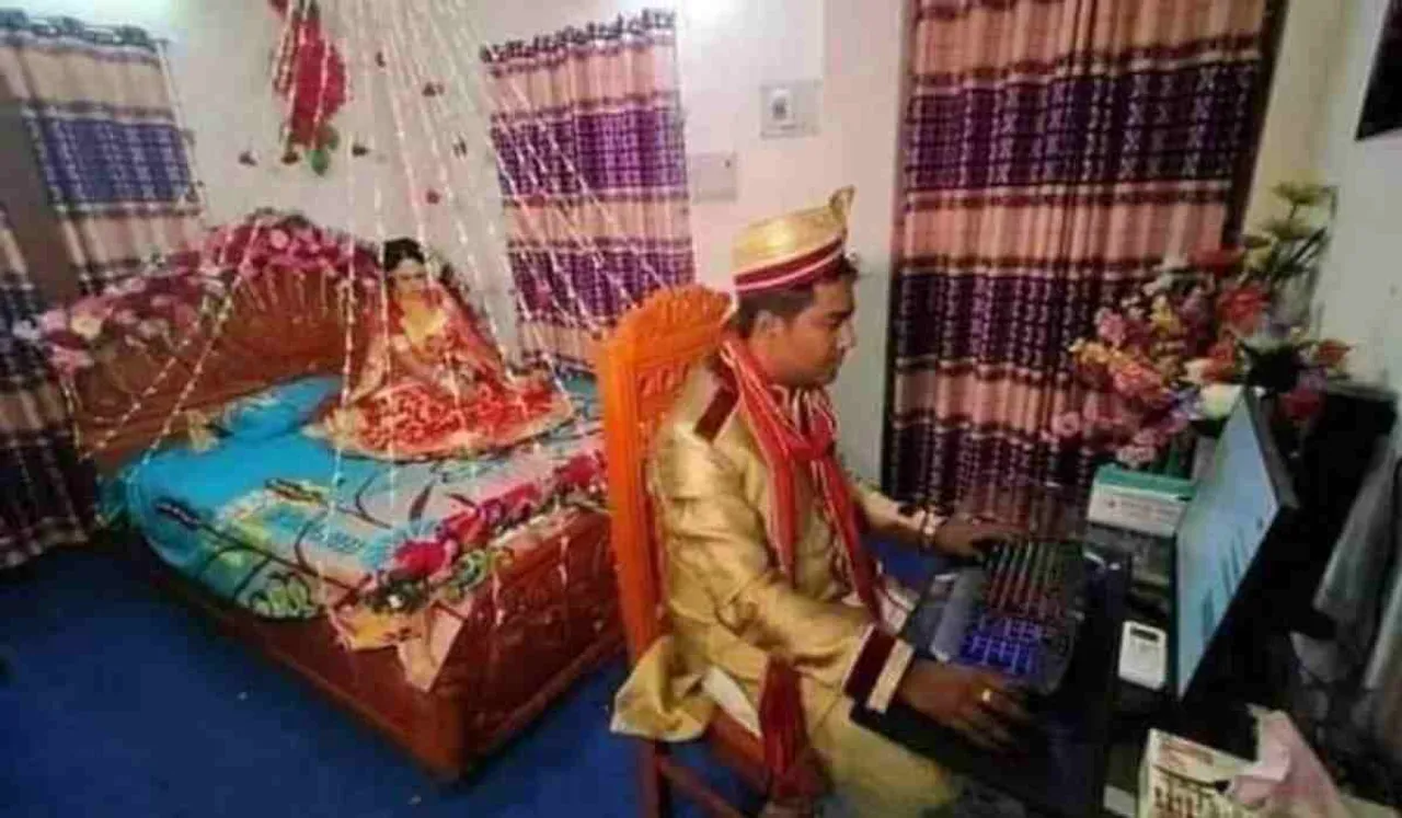 Groom Using Computer On Wedding Night