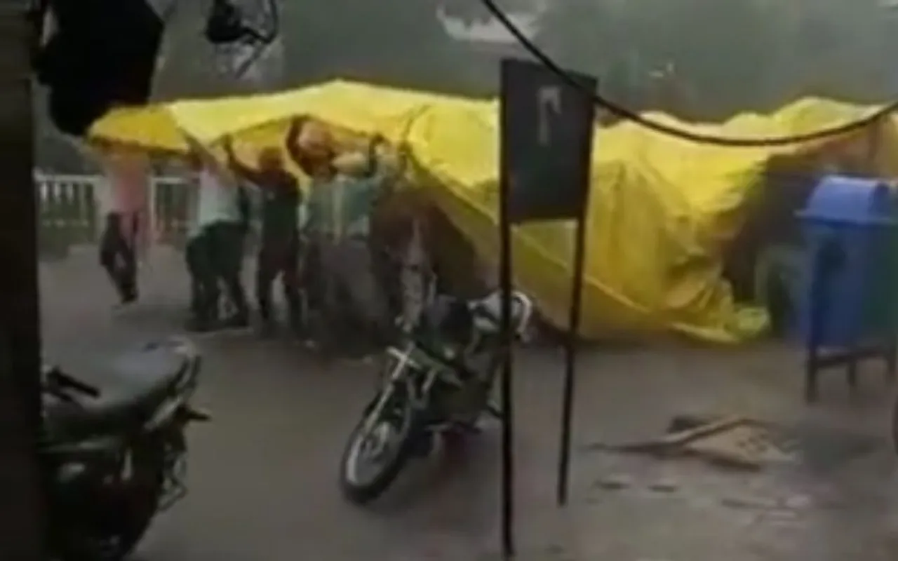 rainy indian wedding procession