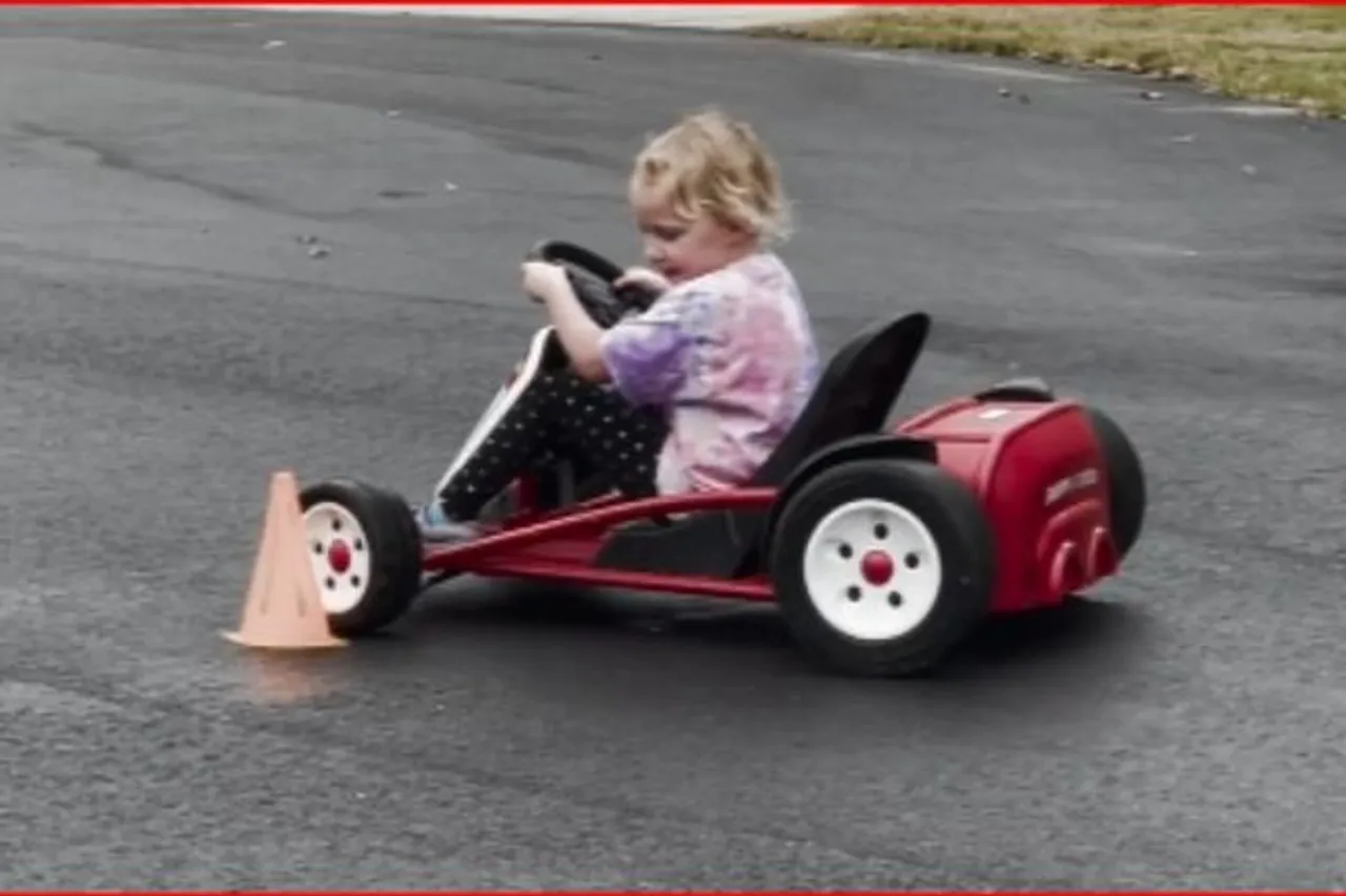 little girl driving go-kart