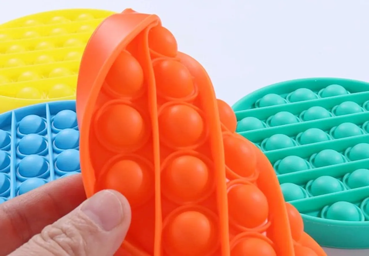 Popping toys, the latest fidget craze, might reduce stress for adults and children alike