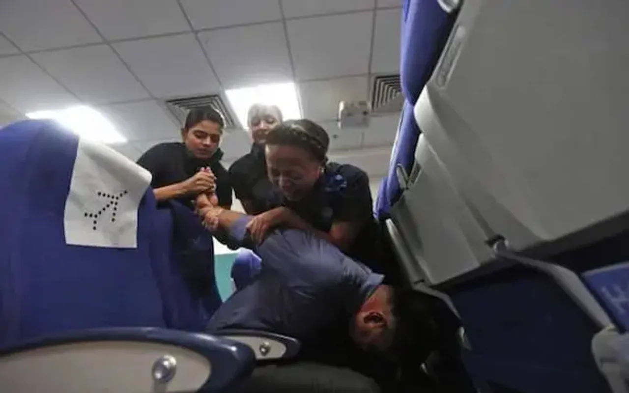 Indigo air-hostesses tie down unruly passenger
