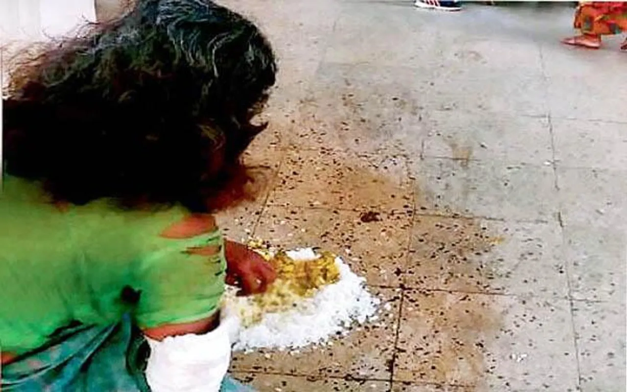 woman eating from floor