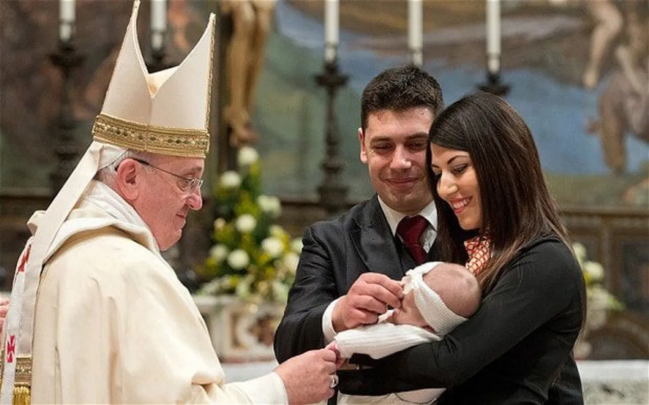 Pope Francis baptises a baby at the Sistine Chapel on January 8, 2017