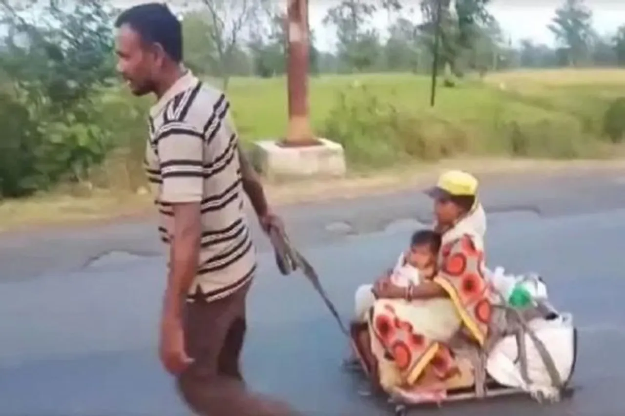 Migrant worker pulls pregnant wife, child on a cart for 700 km