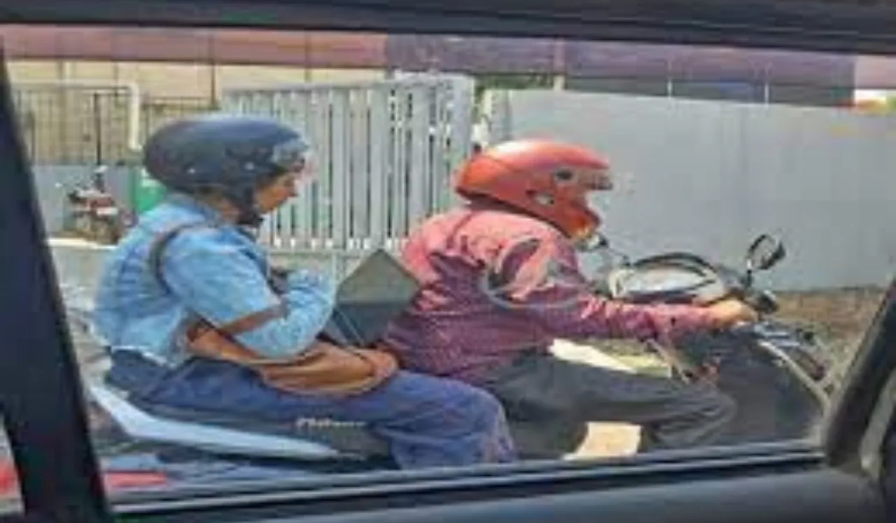 Bengaluru Woman Stuck In Traffic Works On Scooter