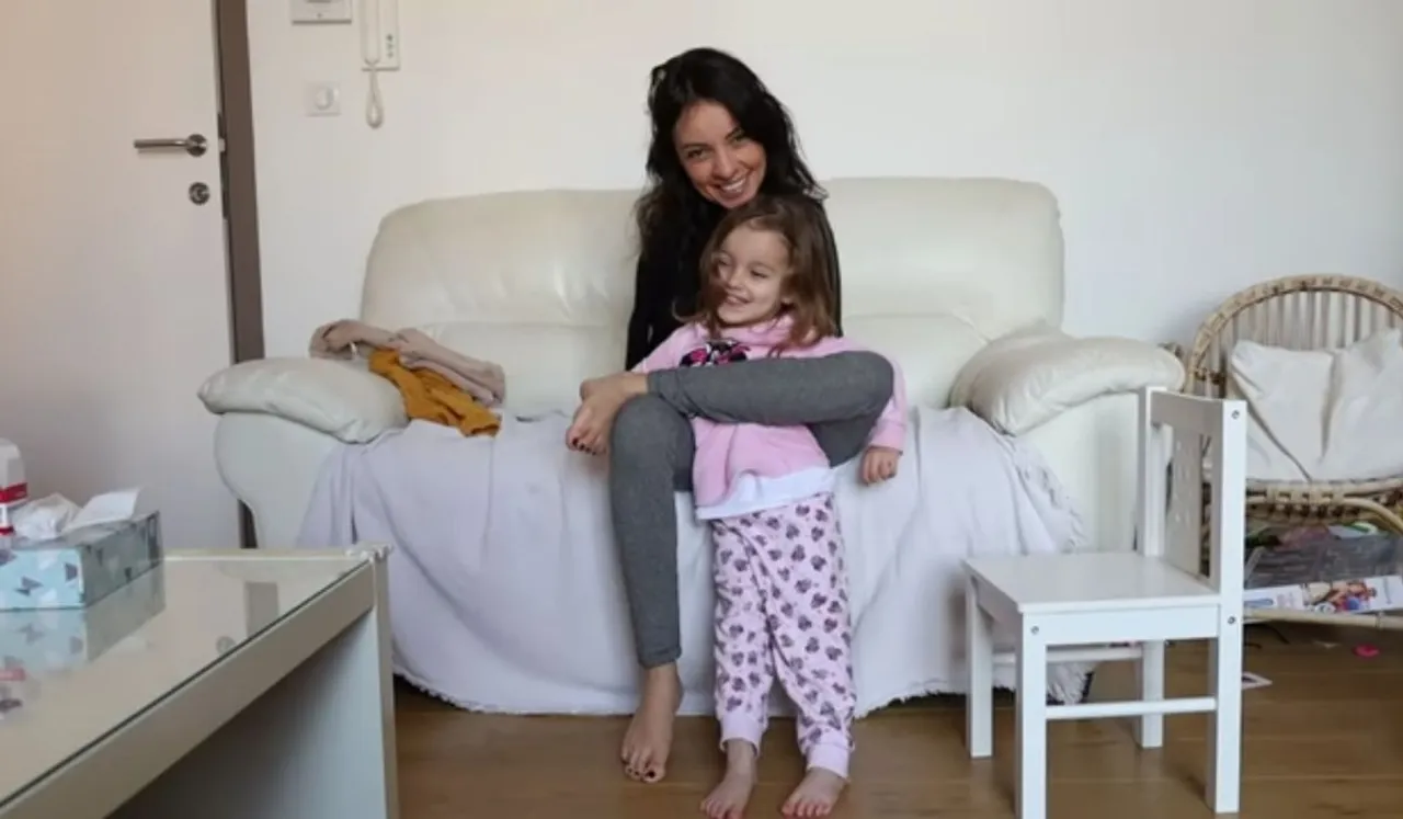Differently Abled Belgian Mother Hailed As Inspiration For Taking Care Of Her Child
